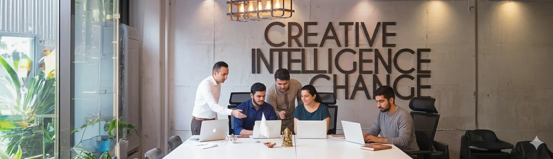 InspireSphere team collaborating around a table in the office